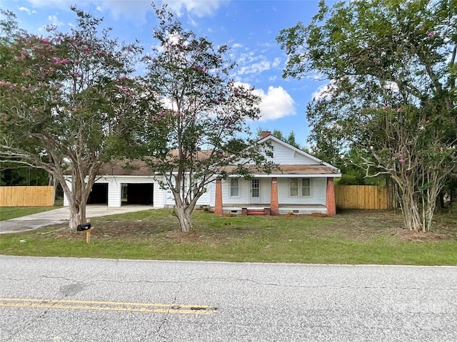 view of front of property with a front lawn and a garage