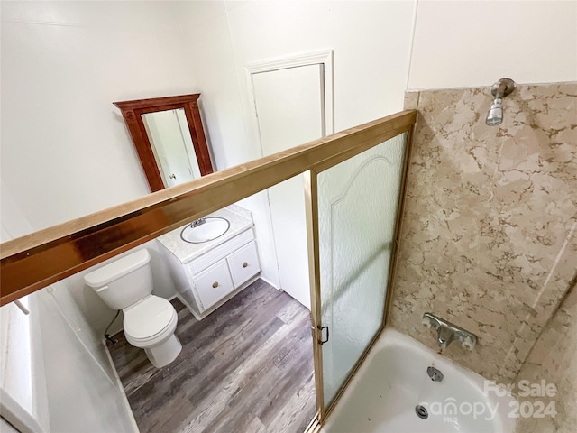 full bathroom featuring sink, separate shower and tub, toilet, and wood-type flooring