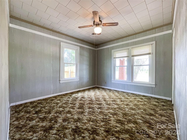 unfurnished room with ceiling fan and carpet flooring