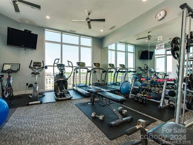 gym featuring ceiling fan