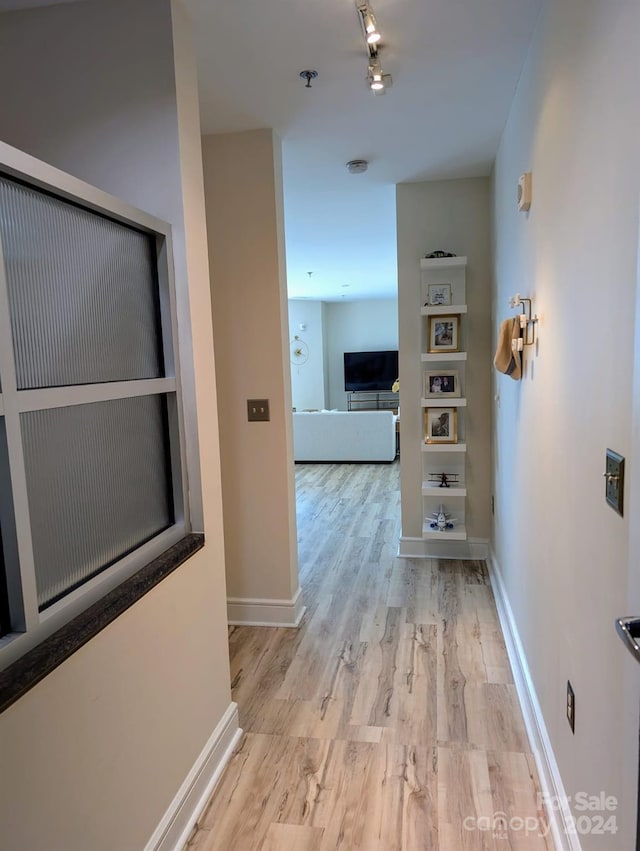 hallway featuring light hardwood / wood-style flooring