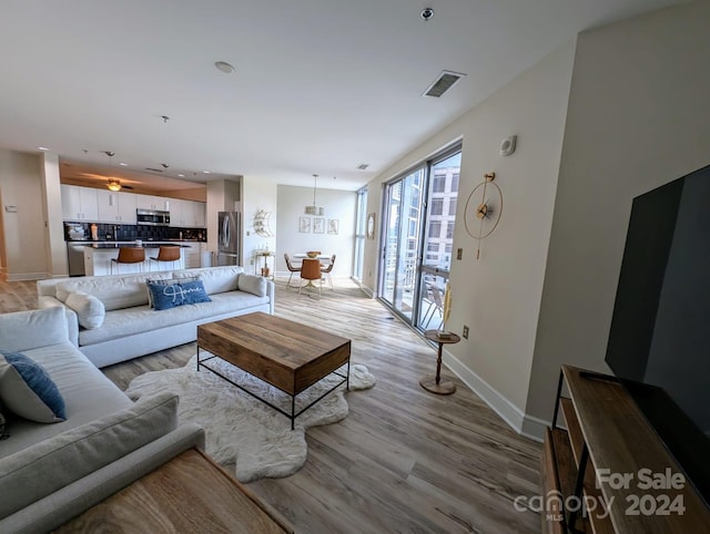 living room with light hardwood / wood-style floors