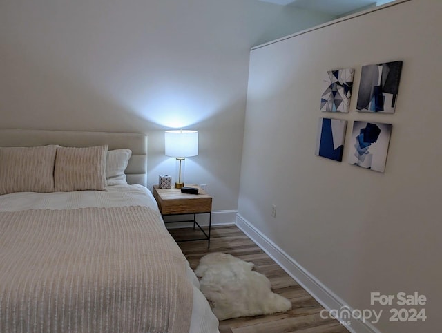 bedroom with light wood-type flooring