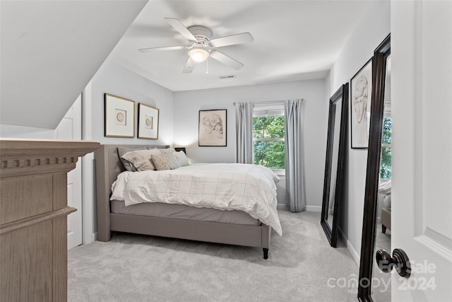 carpeted bedroom featuring ceiling fan