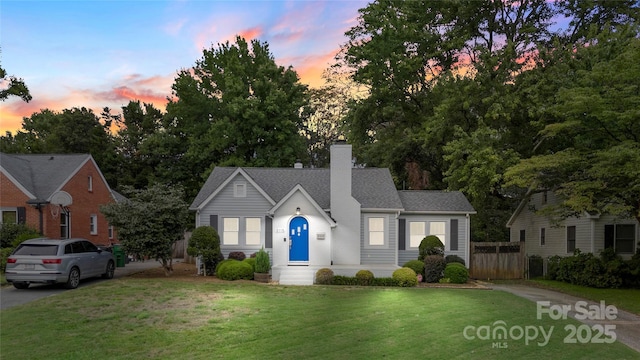 view of front of home with a lawn