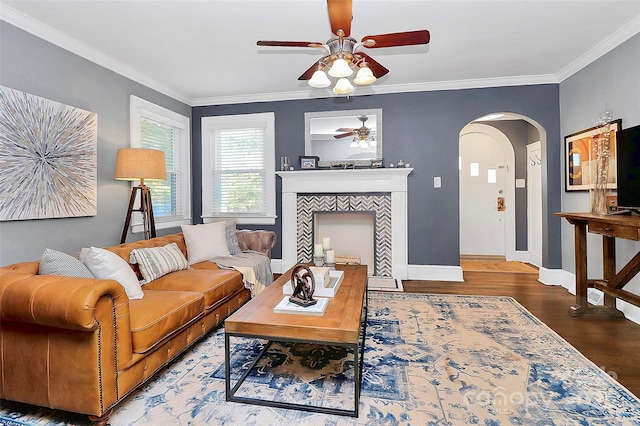 living room with ceiling fan, hardwood / wood-style floors, and ornamental molding