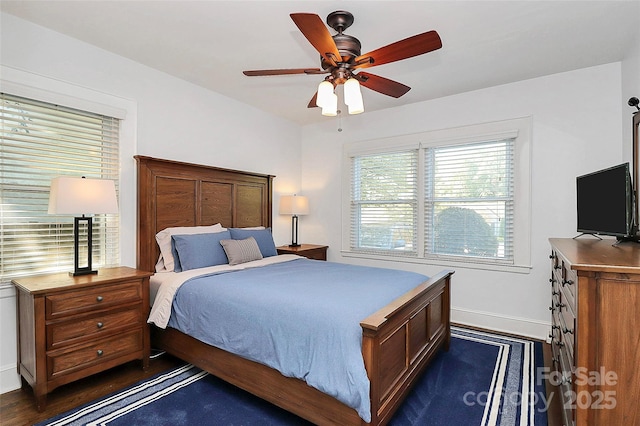 bedroom featuring ceiling fan and dark wood-type flooring