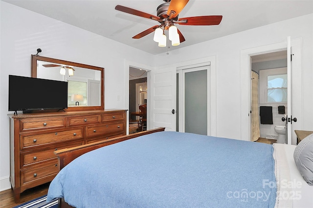 bedroom with hardwood / wood-style floors, ceiling fan, and ensuite bath