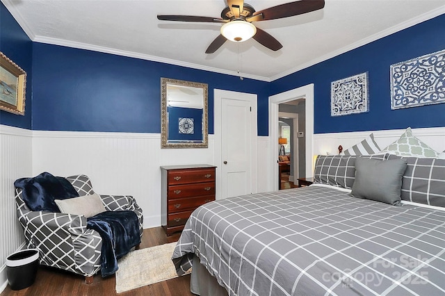 bedroom with ceiling fan, crown molding, and dark wood-type flooring