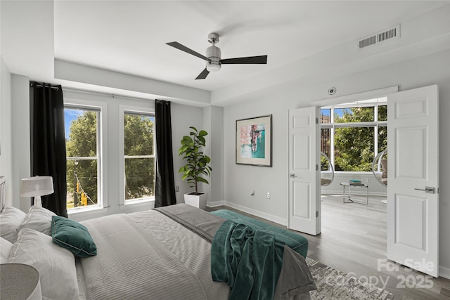 bedroom featuring ceiling fan and light hardwood / wood-style floors