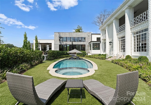 view of pool with a yard