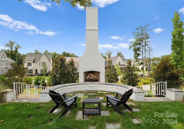 view of yard featuring exterior fireplace