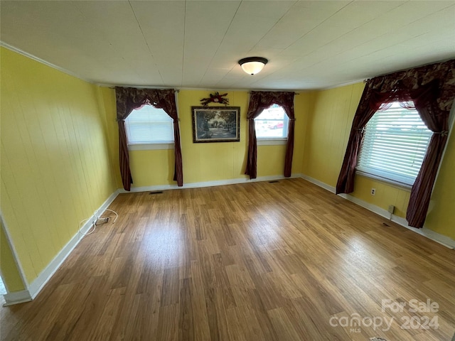 empty room featuring wood-type flooring