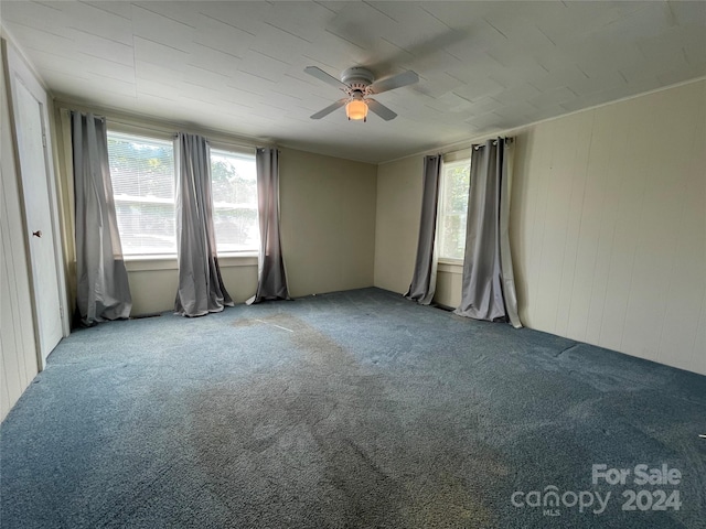 spare room with ceiling fan and carpet floors