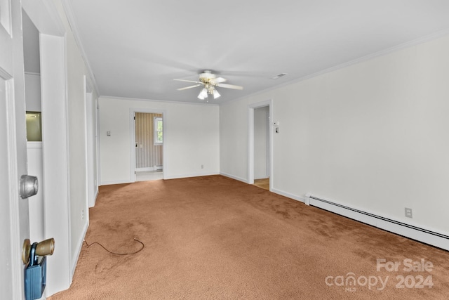 carpeted spare room featuring ornamental molding, a baseboard heating unit, and ceiling fan