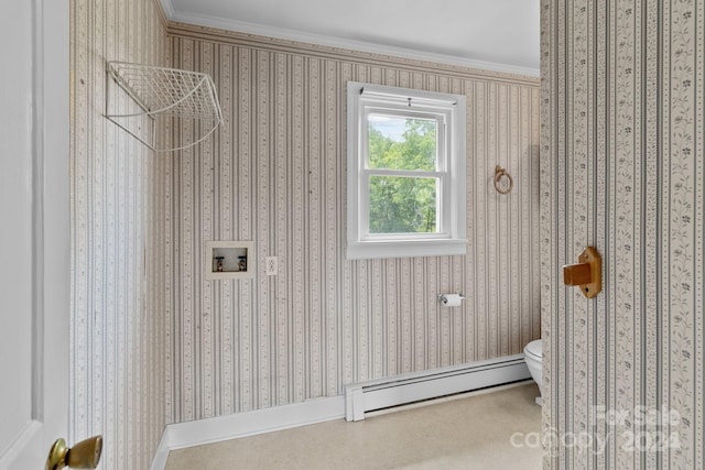 bathroom featuring a baseboard radiator, toilet, and crown molding