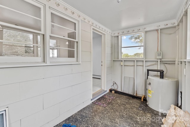 interior space with baseboard heating and water heater