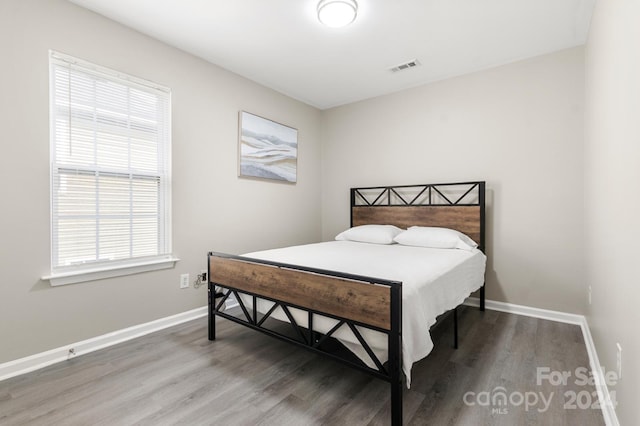 bedroom featuring dark hardwood / wood-style floors