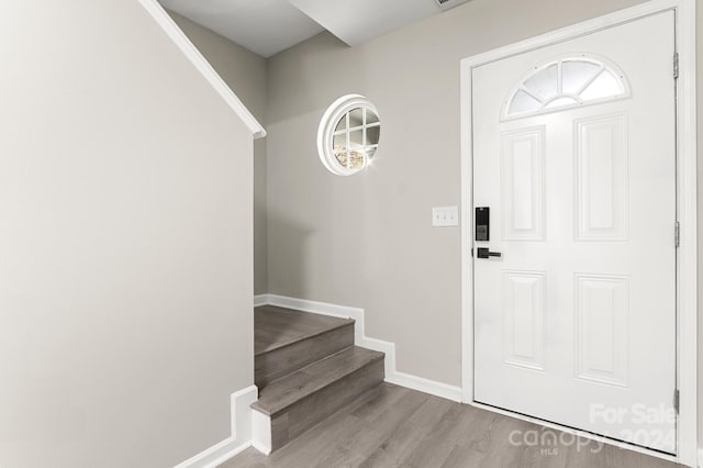 foyer entrance with light hardwood / wood-style flooring