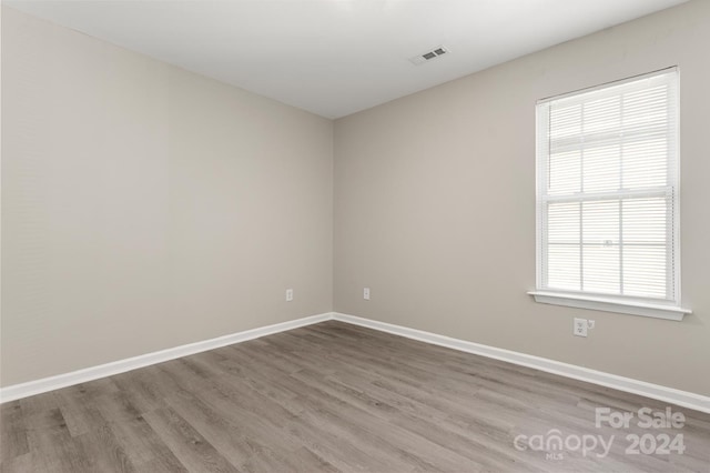 spare room featuring hardwood / wood-style floors