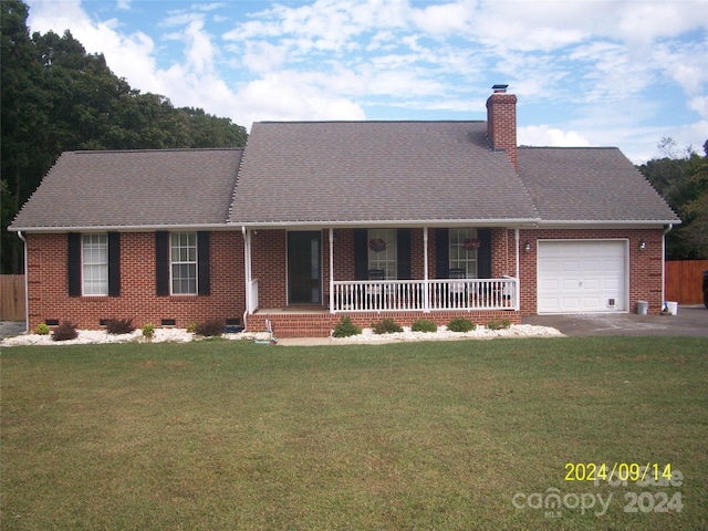 ranch-style house featuring a porch, a garage, and a front lawn