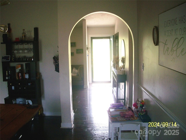 hallway featuring dark hardwood / wood-style floors