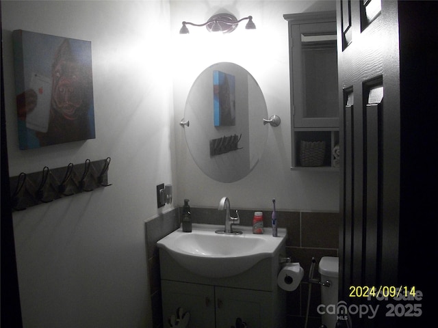 bathroom with vanity and toilet