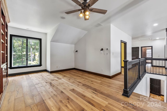 bonus room with light hardwood / wood-style flooring and ceiling fan