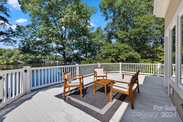 deck featuring a water view