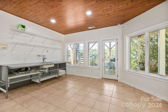 misc room with sink, wood ceiling, and light tile patterned floors