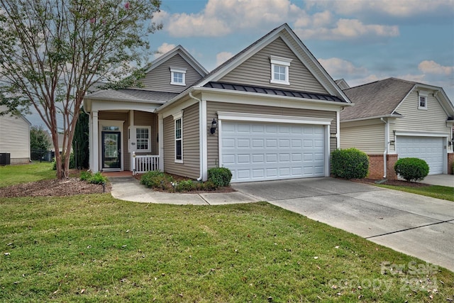 view of front of property featuring a front lawn, covered porch, and central AC