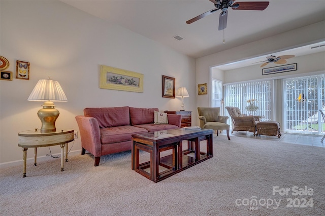 living room with light colored carpet and ceiling fan