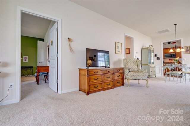 living area featuring carpet flooring