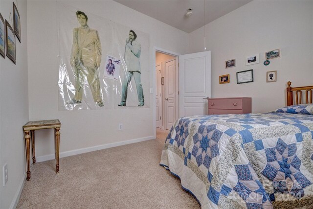 bedroom featuring light carpet