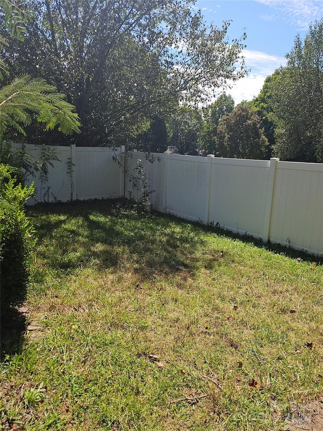 view of yard with a fenced backyard