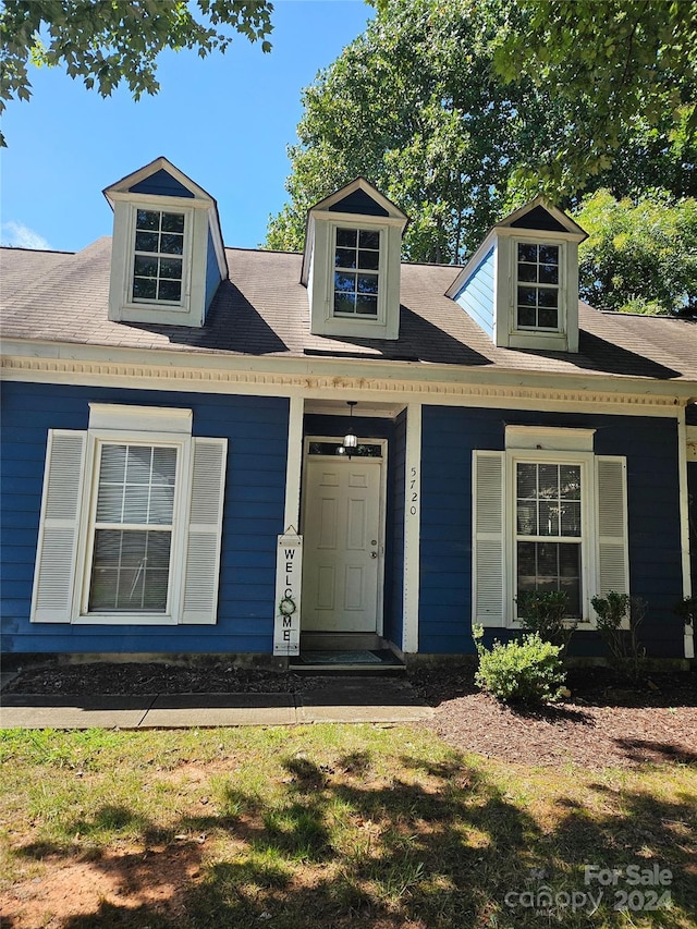 view of new england style home