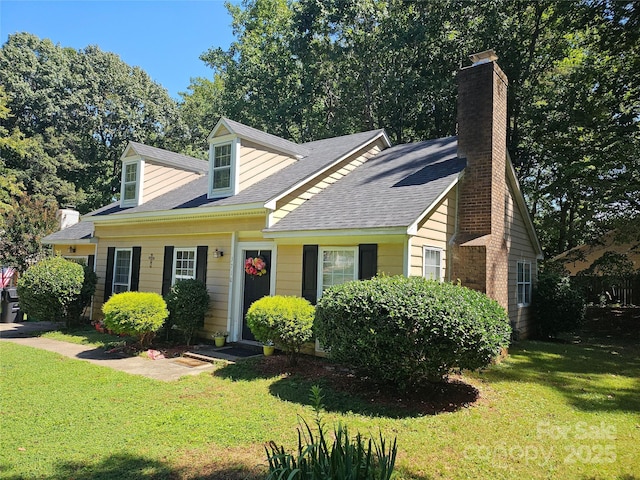 new england style home with a front yard