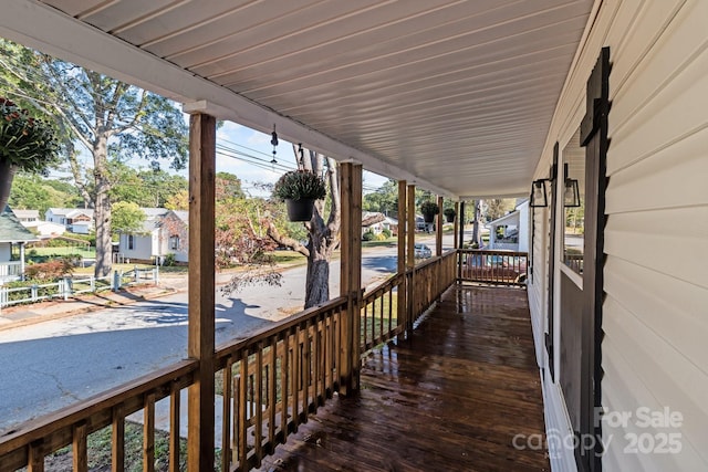 wooden terrace featuring a porch