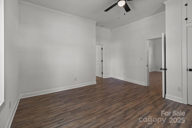 empty room featuring ceiling fan, dark hardwood / wood-style flooring, and crown molding