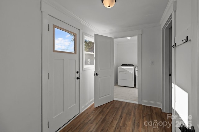 entrance foyer with ornamental molding, dark wood-type flooring, and washer / clothes dryer