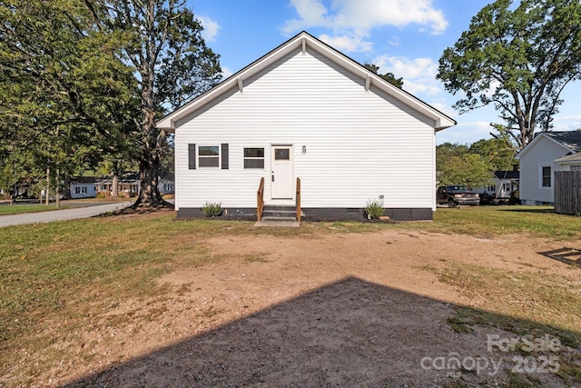 back of house with a yard