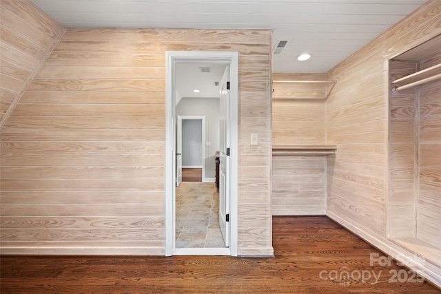 spacious closet with hardwood / wood-style flooring