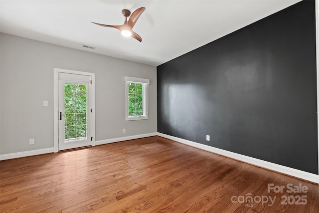 spare room featuring ceiling fan and light wood-type flooring