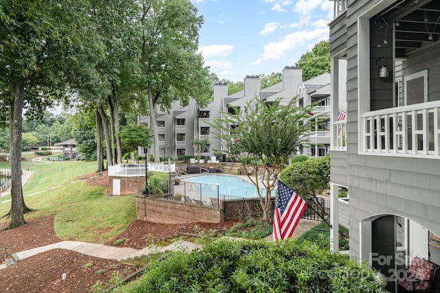 view of pool featuring a yard