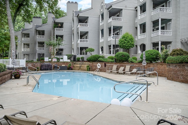 view of pool with a patio area