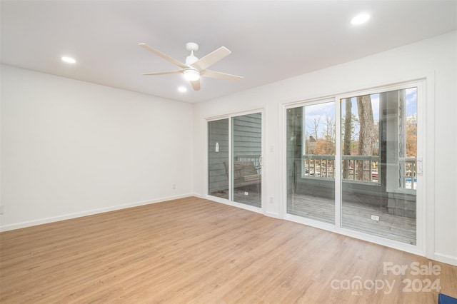 unfurnished room with ceiling fan and light hardwood / wood-style flooring