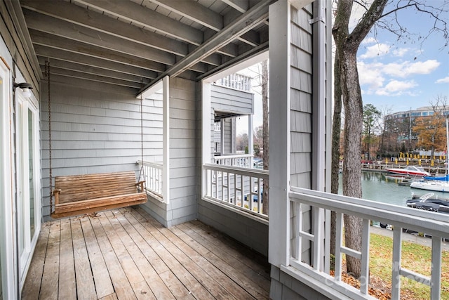 balcony featuring a water view