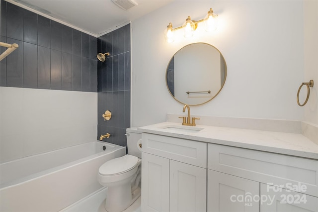 full bathroom with vanity, toilet, and tiled shower / bath