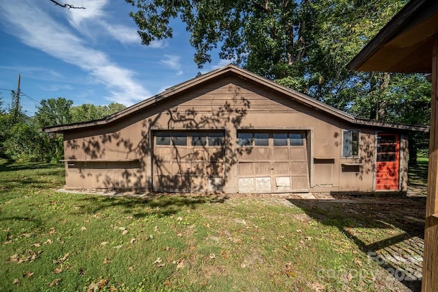 garage with a lawn