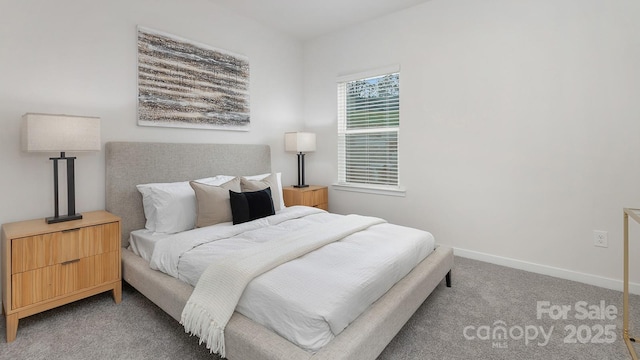 carpeted bedroom with baseboards